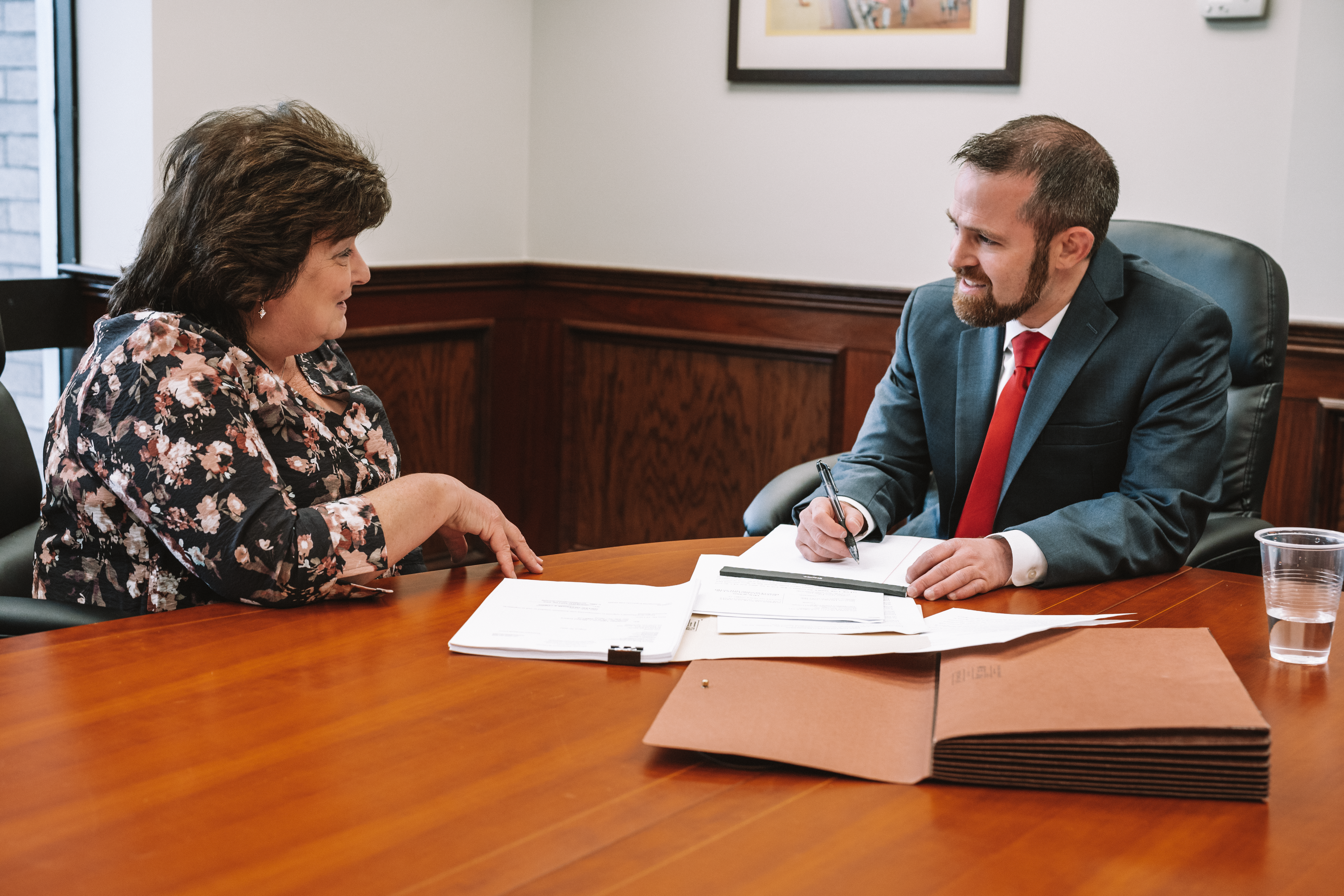 A personal injury lawyer, robert di lauri, esq. meeting with a client, discussing case details and legal options during a free consultation